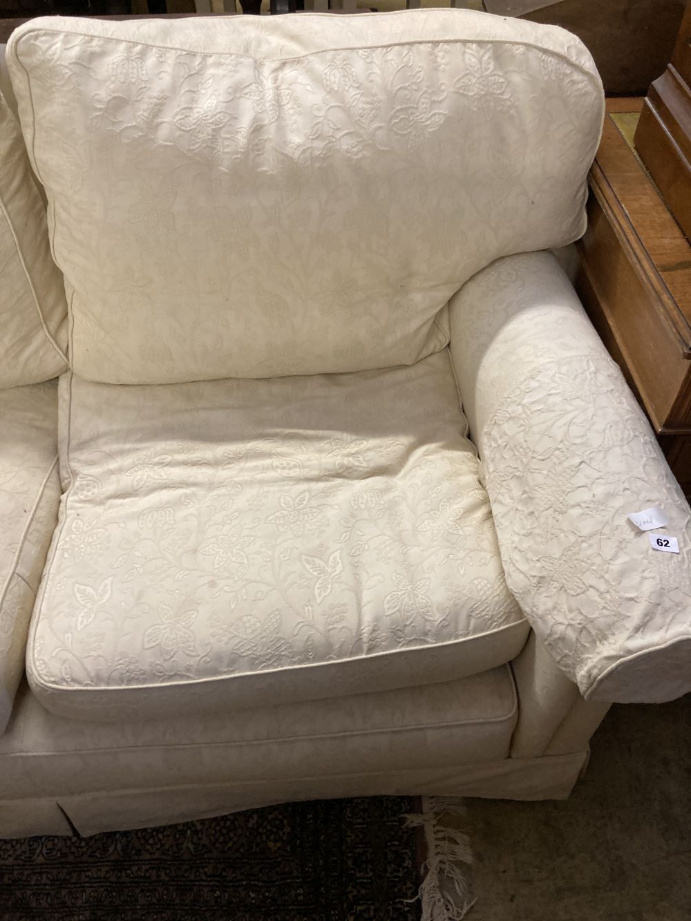 A contemporary cream brocade upholstered two seater settee, width 170cm depth 92cm height 86cm